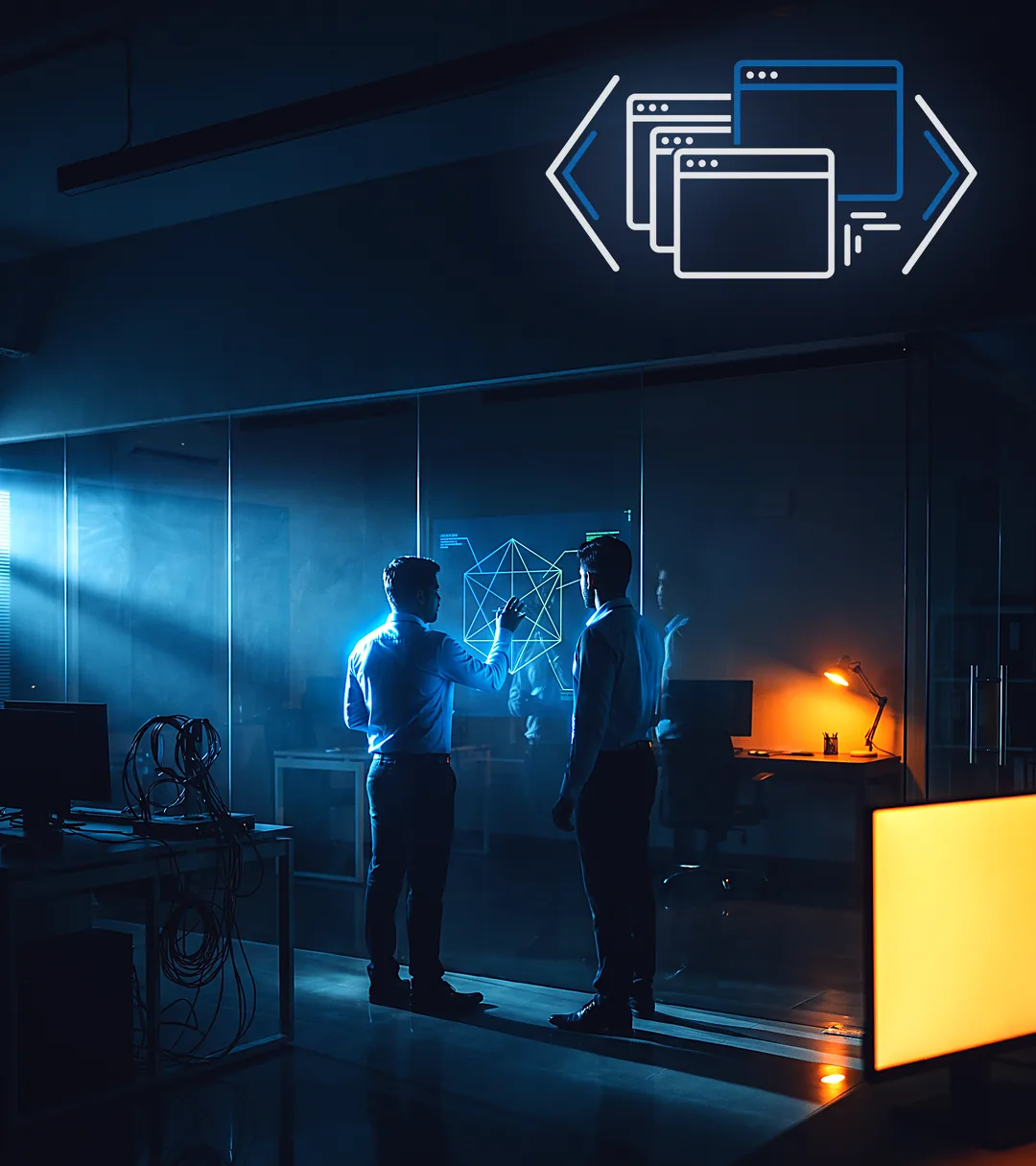 Two engineers standing at a glass partition, working through a glowing architecture diagram in a dark studio